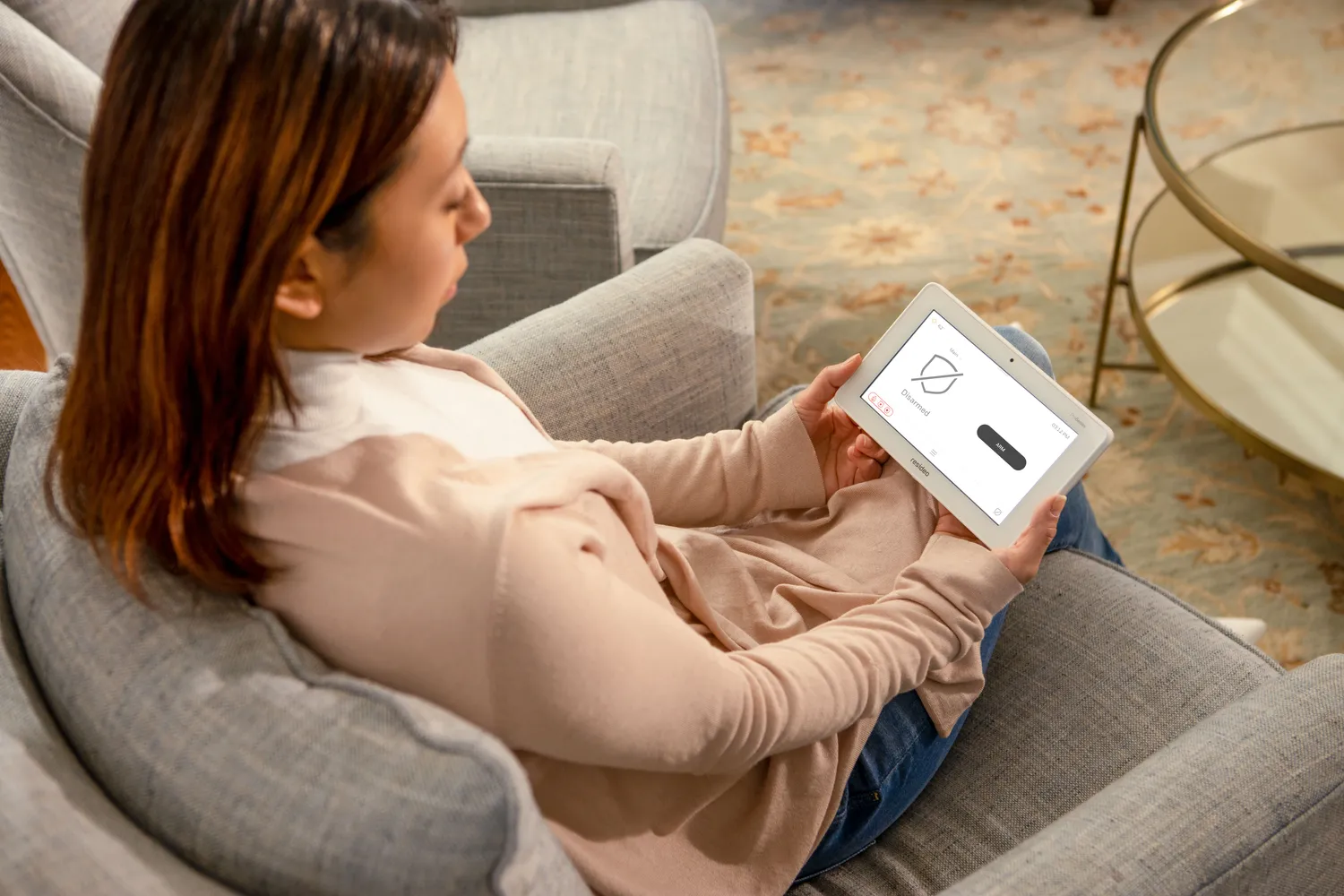 Remote monitoring via smart home security app on tablet – RedFlag Security Ottawa